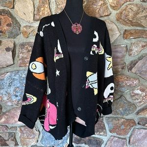 lala. Super COZE and fun spacey over sized cardigan.